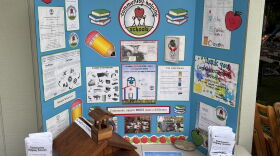 A posterboard illustrating the history, goals and mission statement behind the Community Helping Schools nonprofit, started by Kathie Wells in 2000. This was displayed at the organization's annual garage sale in Kailua on Aug. 15.