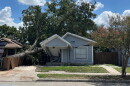 A house crushed by a downed tree from Friday’s storm on Aug. 30, 2026.