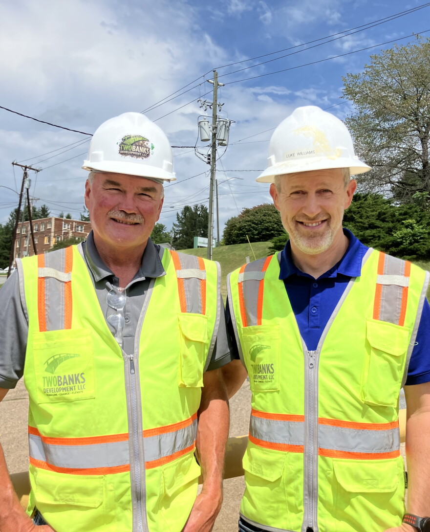 Michael Ferguson, left, and Luke Williams work for Two Banks Development, the local division of the company that purchased the Pactiv Evergreen paper mill site.