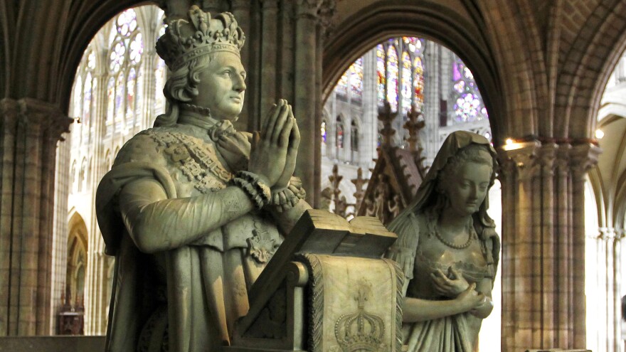 Scientists have established the authenticity of a cloth dipped in the blood of France's King Louis XVI. A memorial depicts the executed king and Queen Marie-Antoinette at Saint-Denis, near Paris.