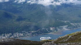 A cruise ship approaches its stop in downtown Juneau, Alaska, as glimpsed from along the Mount Roberts trail. (Becky Bohrer/AP)