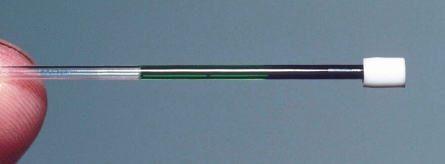 A centrifuge can separate the components of lizard blood. In this tube, red blood cells are on the right and green blood plasma is on the left. This sample came from the green-blooded lizard <em>Prasinohaema prehensicauda, </em>which lives in the highlands of New Guinea.