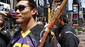 Brett Bucktooth, a member of the Iroquois Nationals Lacrosse team and Syracuse University's 2004 national championship team, visit Times Square, New York, Monday, July 12, 2010. The 23 players on the Iroquois Indian lacrosse team cannot fly to England for what's considered the Olympics of the sport because the U.S. government won't allow them to re-enter the country on Iroquois nation passports. "This is a world championship. I am hoping there is a resolution to this problem quickly," said Bucktooth. (AP Photo/Bebeto Matthews)