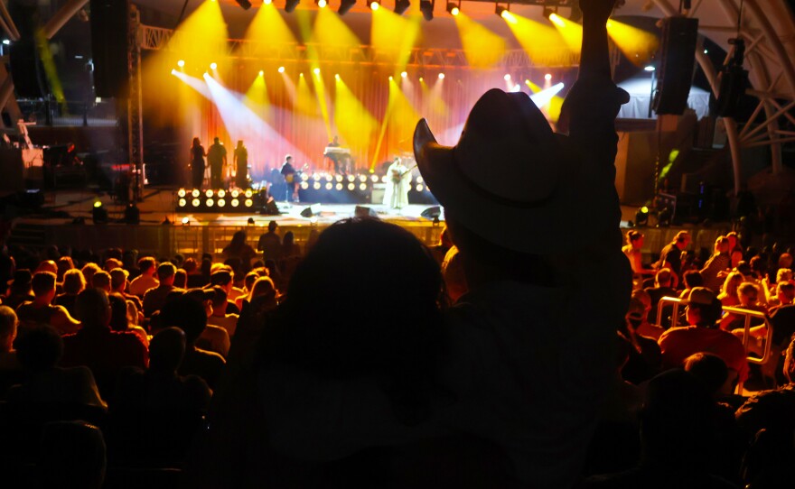 A couple watches the Alabama Shakes play.