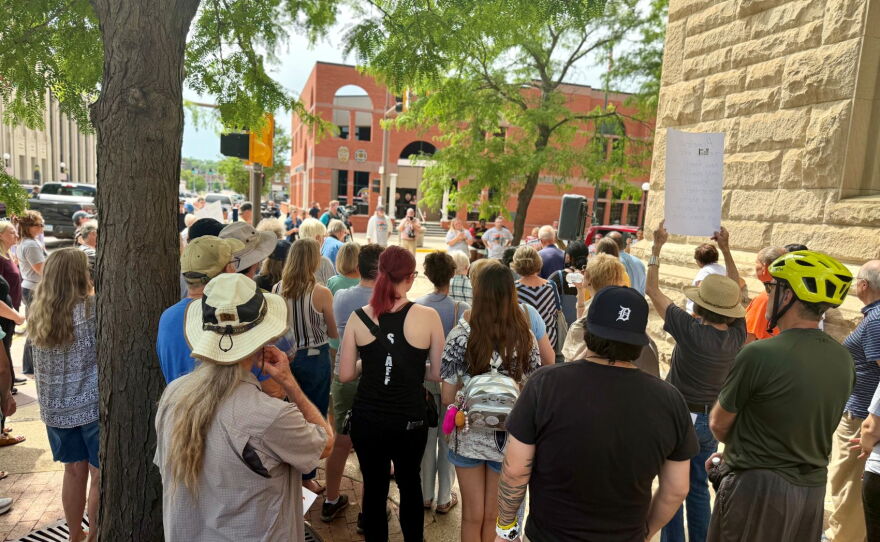 About 100 people show their support for Sioux City's Warming Shelter before a city council meeting on Monday.
