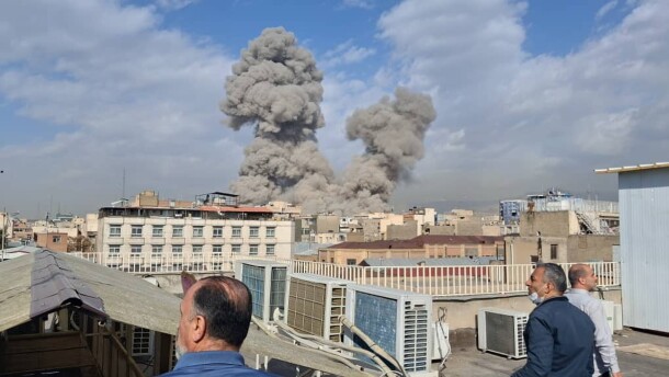 People watch as smoke rises on the skyline after an explosion in Tehran, Iran, Saturday, Feb. 28, 2026.(AP Photo)