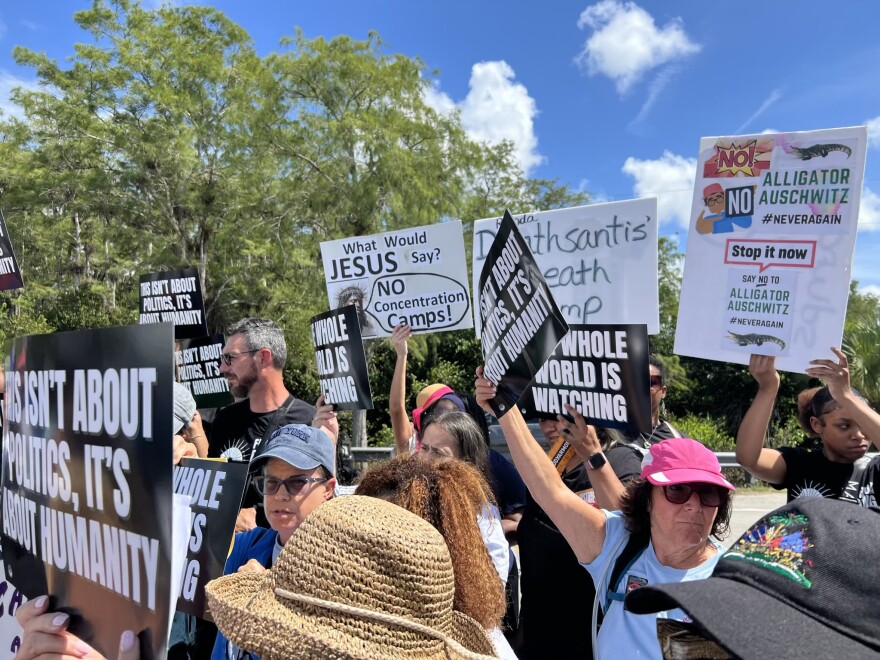 Dozens gathered at a protest and press conference outside Alligator Alcatraz on Tuesday, July 22, 2025, to denounce the poor health conditions at the controversial immigration detention center in the Everglades.