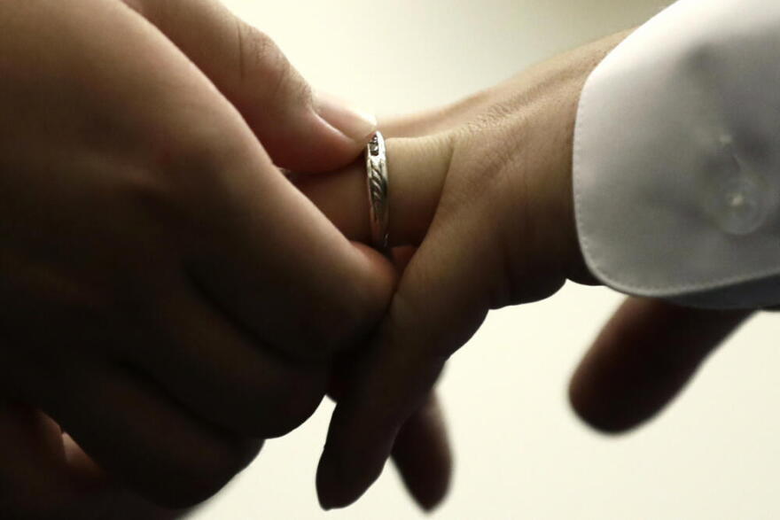 A couple exchanges wedding bands at City Hall in Philadelphia, Oct. 11, 2018. (Matt Rourke/AP)