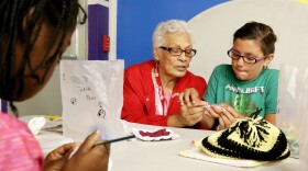 (Joy Bonala/KACU) Foster Grandparent Marian Rivas teaches crochet Tuesday, June 27, 2017 at the Martinez Boys and Girls Club in Abilene. 