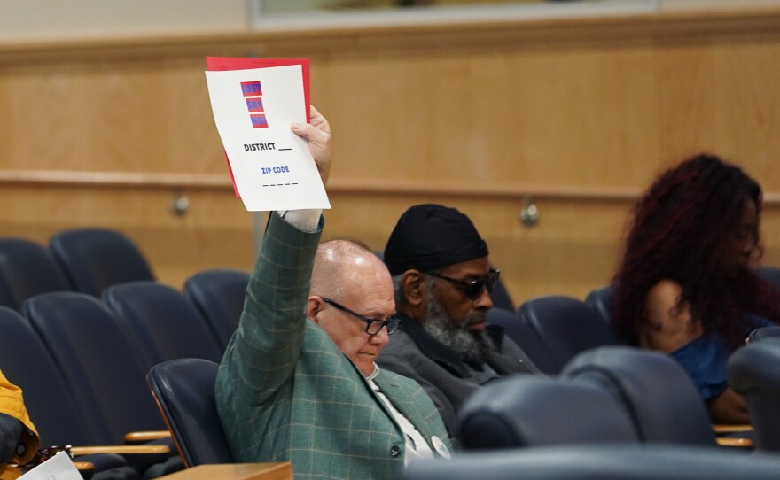 Virginia Beach resident Eddie Seay holds a sign that says "Just say no" to a referendum on the city's voting system Tuesday, April 15, 2025 at City Hall. City council will vote next month on adding a referendum to the November ballot.