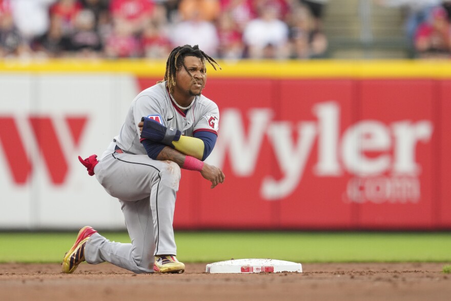 Cleveland Guardians' José Ramírez reacts after he is caught stealing second base by Cincinnati Reds shortstop Elly De La Cruz during the third inning of a baseball game, Saturday, May 17, 2025, in Cincinnati. 