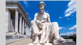 Statue of Thucydides sitting in front of Austrian Parliament Building in Vienna, Austria.
