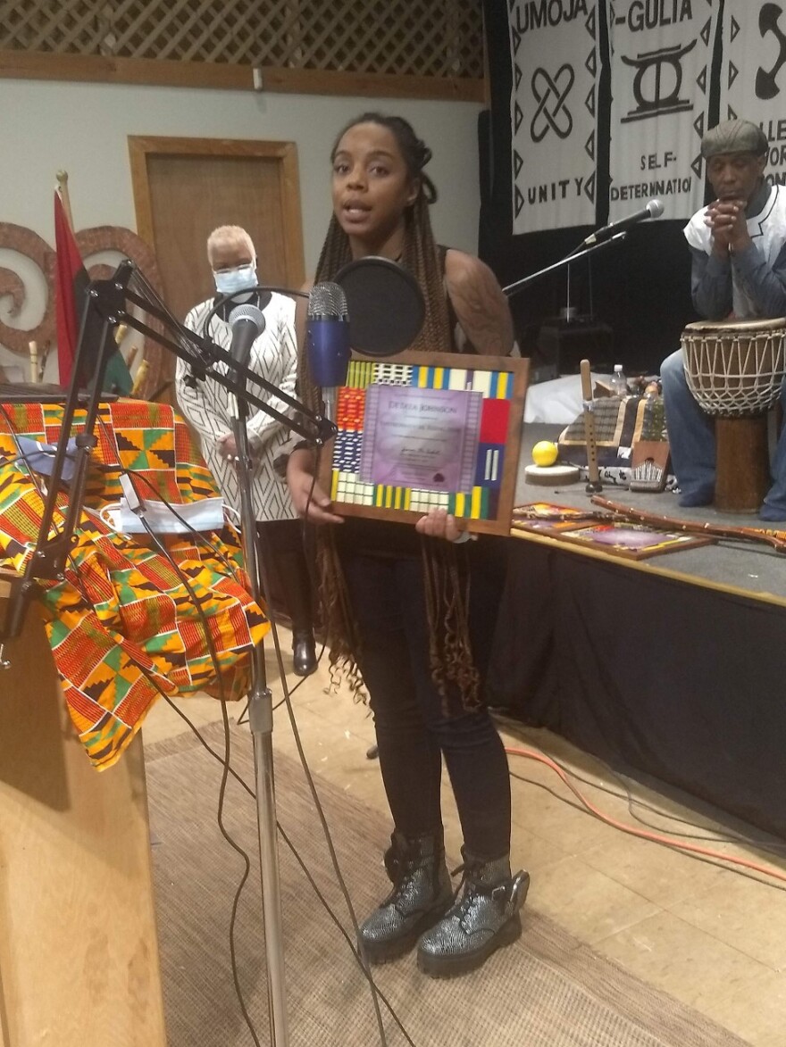 Yvonne McCaskill looks on as urban agriculturist & educator Detaya Johnson accepts her pioneer award.