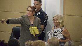 A North Port staffer directs a public commenter.