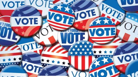 An artistic rendering of multiple buttons with the word 'vote' on them.
