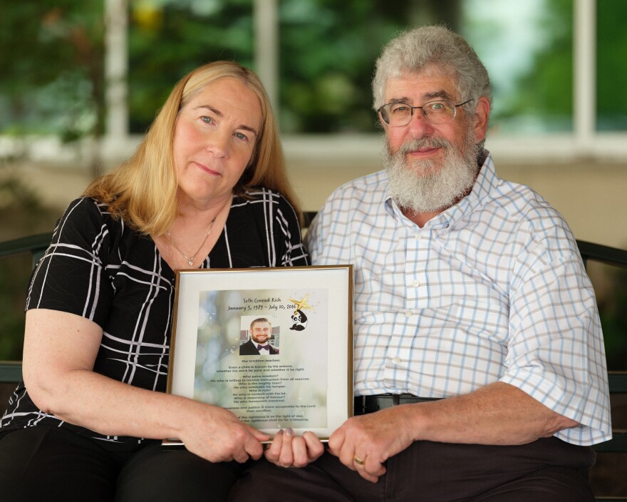 Mary Rich, shown with her husband, Joel, at their home in Omaha, Neb., says self-promoters they trusted to help solve the killing of their son took advantage of them. "You're a total sucker," Mary Rich says. "I think every day: Who's going to bug us? What's coming at us? I will always think that."