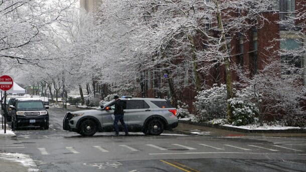 A police car blocks a street near the Brown University campus on Sunday, Dec. 15, 2025.