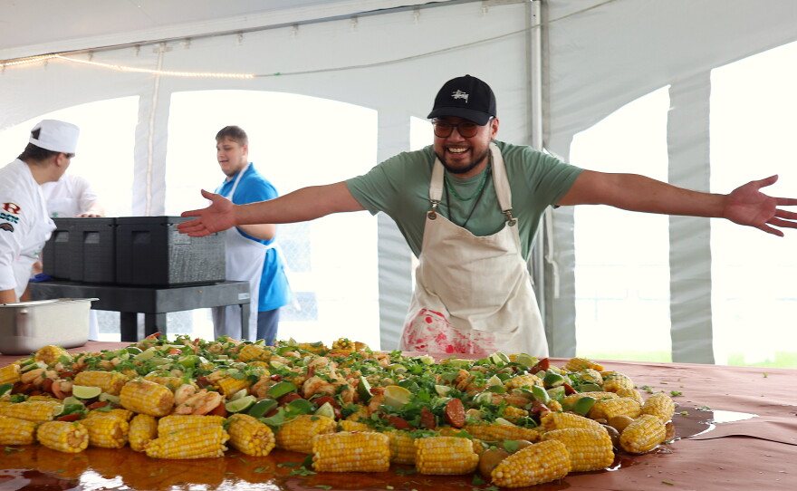 Chef Tony Vu of The Good Bowl presents his Viet Cajun Low Country Boil at the Traverse City Food and Wine Festival.
