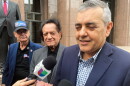 FILE - Former U.S. Rep. David Rivera speaks with media outside a federal court in Miami, Dec. 20, 2022.