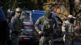 A U.S. Border Patrol agents look on