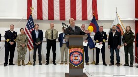 Gov. Jared Polis speaks to reporters during a briefing on Colorado's wildfire outlook at the state Division of Fire Prevention and Control hangar in Broomfield on Thursday, April 30, 2026.