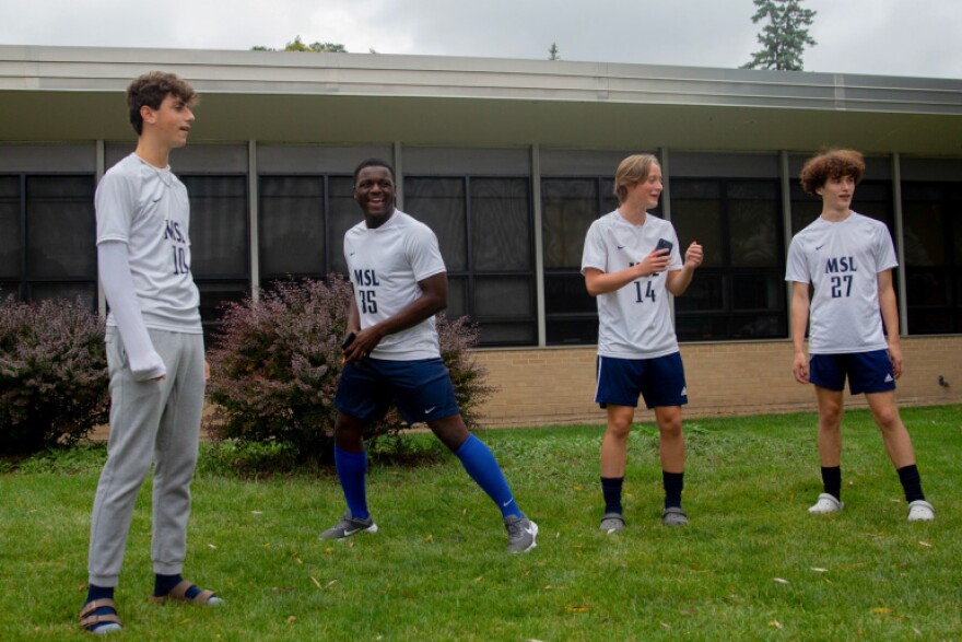 Peter Lowry, second from left, plays soccer with his teammates outside of Milwaukee School of Languages on Sept. 28, 2023, in Milwaukee. Heat can be so oppressive in classrooms that, some days, it distracts the high school junior from learning. Also pictured, from left, are: Kyle Gagliano, Bryce Vogt and Micah Sandvig.