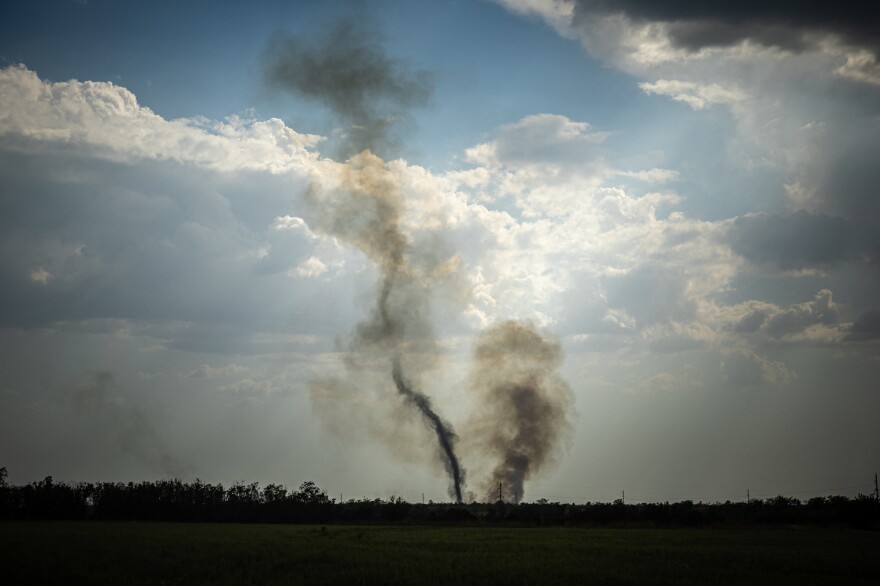 Black smoke rises at the front line in southern Ukraine's Mykolaiv Oblast on Aug. 30 amid Russia's military invasion of the country. Ukraine has begun a major counteroffensive to retake areas in the south that Russia seized early in the war.