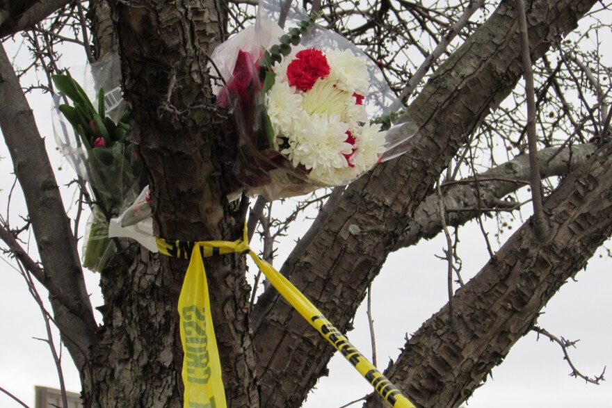 File photo of flowers left near the Cracker Barrel restaurant in Texas Township, one scene of a Kalamazoo Area shooting spree in 2016. Photo by Gordon Evans, WMUK