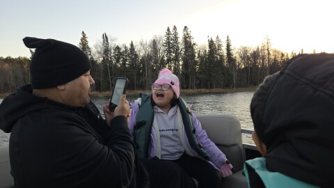 Endazhi-Nitaawiging families celebrate the arrival of the school's new pontoon on Nov. 12, 2025, on Fuller's Lake on the Red Lake Nation.