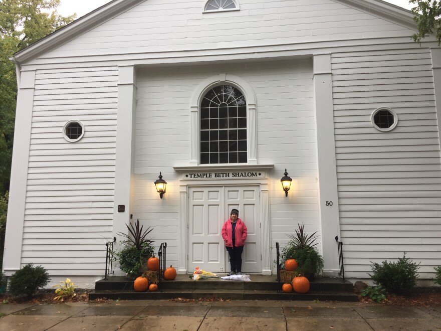 Robin Selinger, cantorial soloist at Temple Beth Shalom in Hudson, says she was heartened to find flowers left on the temple's front steps following the attack in Pittsburgh.