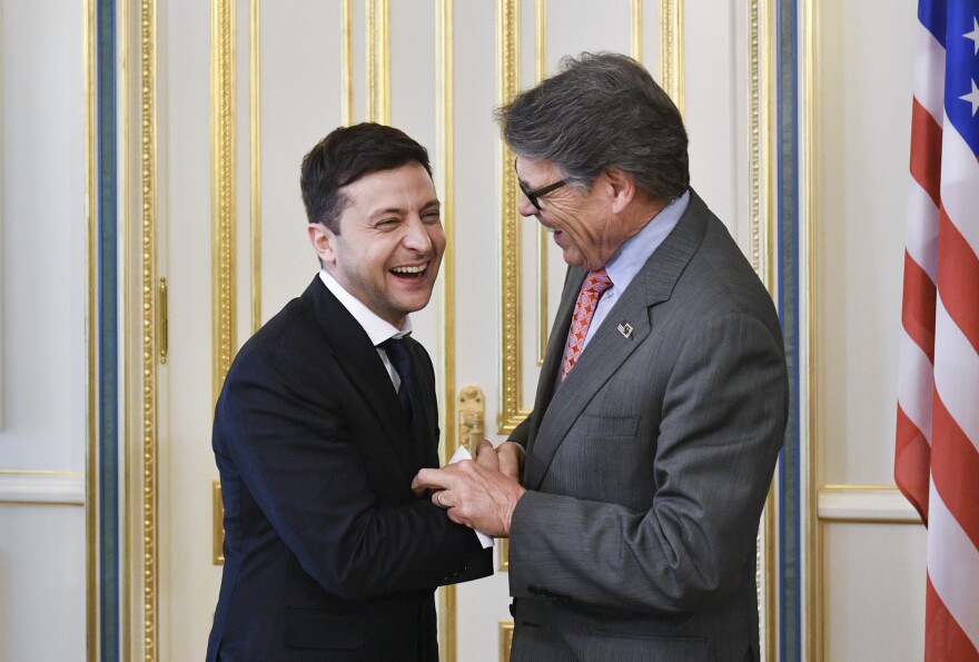 Ukrainian President Volodymyr Zelenskiy (left) and U.S. Energy Secretary Rick Perry share a joke during a meeting in Kyiv, Ukraine, this past May.