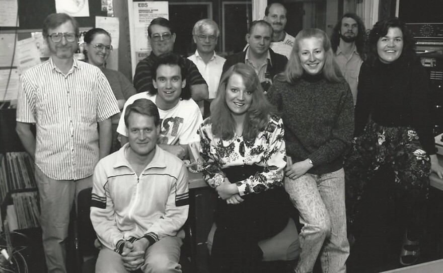 Back Left Host Don Woods, General Manager Lyle Metler, Center News Director, Bob Beck and Right Engineer, Chris Heck, Front Left Pat Gabriel, Programmer - 1991
