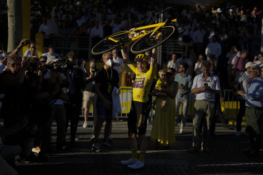 Vingegaard celebrates his win in the men's Tour de France.