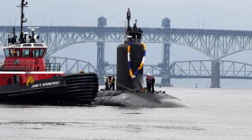 The Virginia-class submarine USS Minnesota (SSN 783) heads up the Thames River toward Naval Submarine Base New London in Groton.
