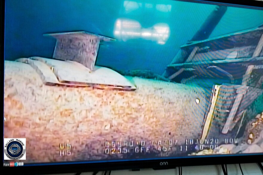 FILE - This photo provided by the Michigan Department of Environment, Great Lakes, and Energy in June 2020 shows damage to anchor support EP-17-1 on the east leg of the Enbridge Line 5 pipeline in the Straits of Mackinac in Michigan, displayed on a television screen.
