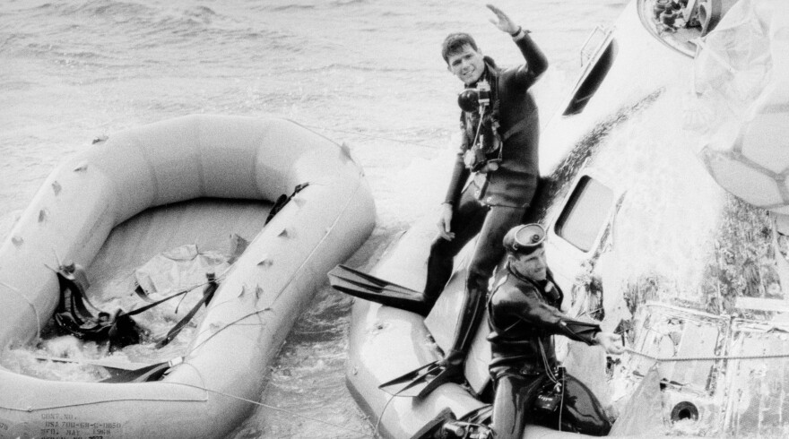 US Navy Frogmen Recover Apollo 8;  Lt. Richard Flanagan (Left) waving and Bob Coggin (Right) attaching flotation collar