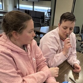 Ashley and Jessica smell lavender oil during the aromatherapy part of the natural childbirth class.