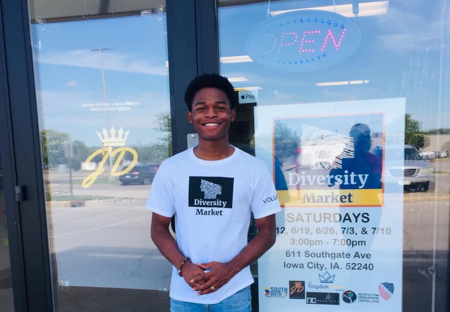 LaDamus stands in front of his family-owned JD Beauty Supply in Iowa City. Tasha Lard, the owner, is a co-chair on the South District Diversity Market Event Committee.