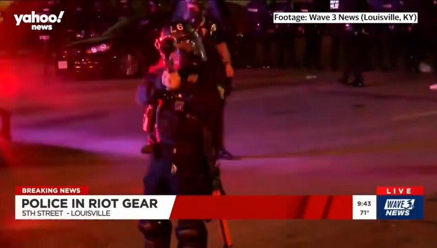 Louisville Police officer Dusten Dean firing pepper balls at a news crew in 2020