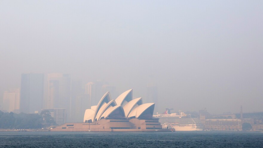 Much of New South Wales, Australia, including the Sydney Opera House, lay under a shroud of smoke Thursday. The state remains under severe or very high fire danger warnings as more than 60 fires continue to burn within its borders.