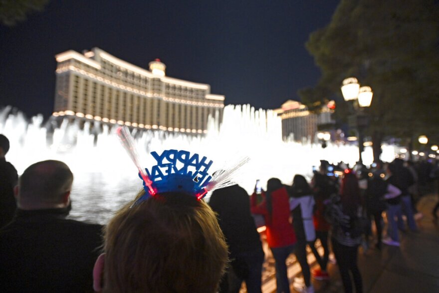 People ring in 2021 at the fountains outside the Bellagio. The Strip fireworks show is back this New Year’s Eve after the pandemic forced its cancellation last year.