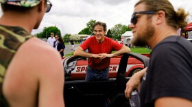 Mehmet Oz, a Republican candidate for U.S. Senate in Pennsylvania, meets with attendees during a visit to a car show in Carlisle, Pa., Saturday, May 14, 2022. 
