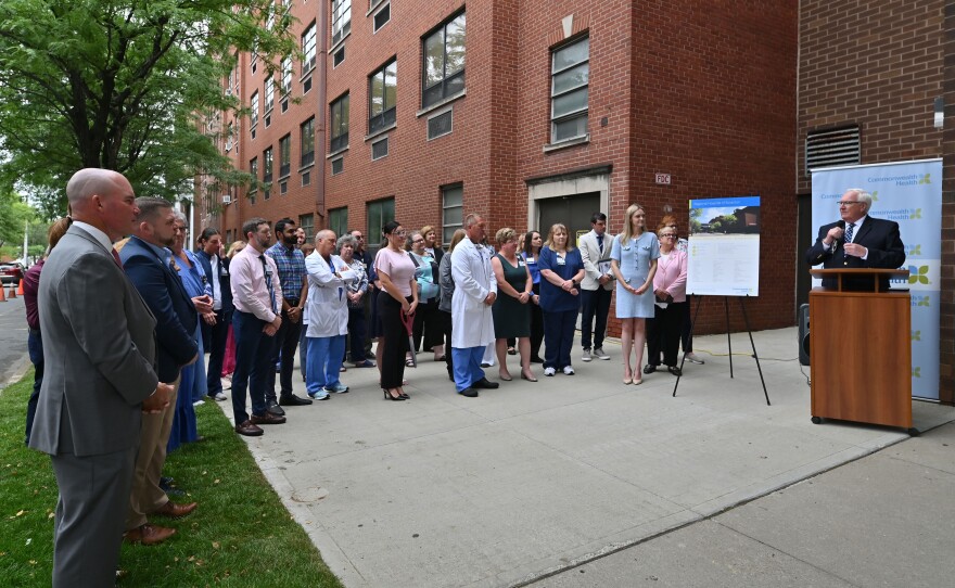 Michael Clark speaks outside Regional Hospital of Scranton during a ceremonial reopening ceremony Monday morning.