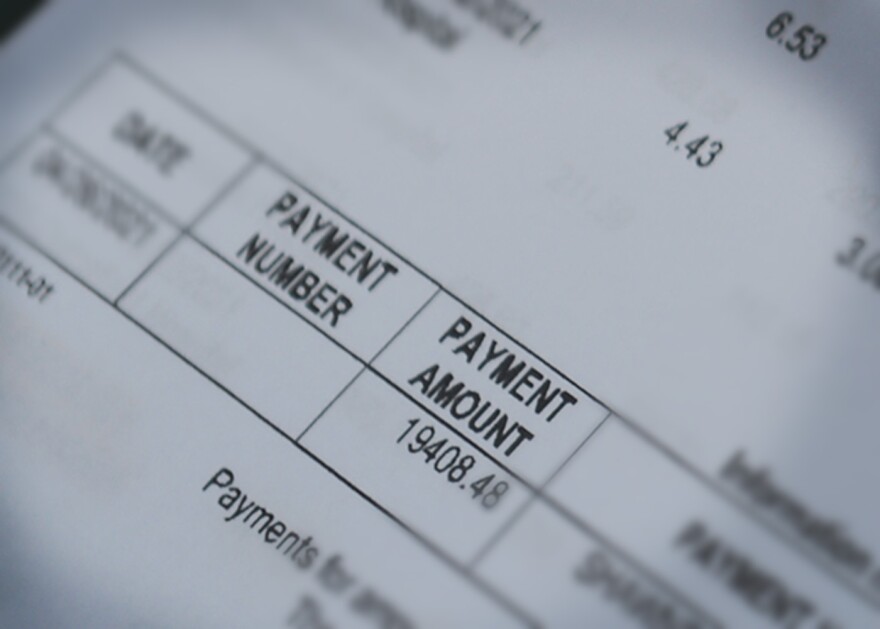 A photo shows a hospital bill for $20,000.