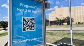 A bus stop ad in Oklahoma City near Northwest Classen High School offers a website for pregnant women to get more advice on Tuesday, July 9, 2024. The QR code goes to a website for Hope Pregnancy Center, one of several crisis pregnancy centers in Oklahoma.