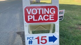 A sign shows voters where to cast ballots in Charlotte's Plaza Midwood neighborhood on May 17, 2022.