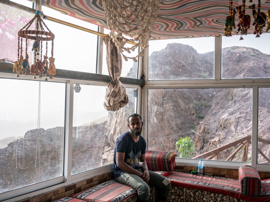 Awadallah Suleiman, a Sudanese migrant worker taking care of an empty souvenir shop on the road from Amman to Petra. The coronavirus pandemic has brought Jordan's vital tourism industry to a dramatic halt, and with it, the livelihoods of hundreds of thousands of workers.