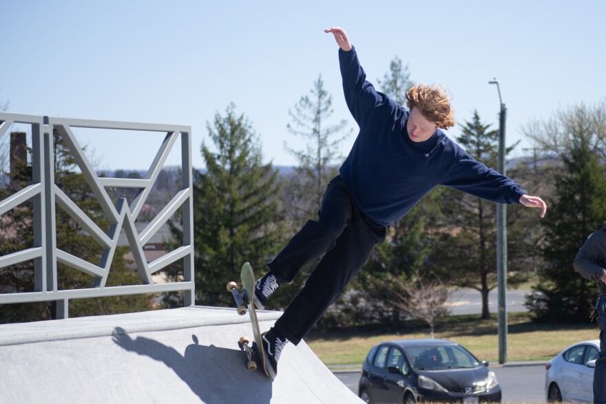 Travis Legg, of Harrisonburg, rides a quarter pipe on the opening day of the Westover Skate Park.