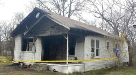 A fire Monday night heavily damaged a Commerce house that was the scene of a shooting last week during which two people were wounded.