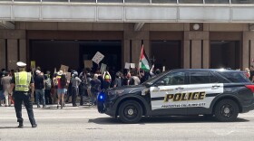 Police direct traffic on Westbound Commerce Street and attempt to establish control of the protest in front of the Marriott Rivercenter in San Antonio, TX, during the Turning Point USA Women's Leadership Summit 2026.